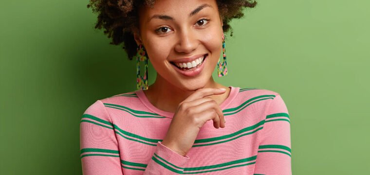 portrait-of-good-looking-curly-haired-woman-keeps-ZDL9EAG.jpg