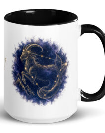 White ceramic mug with black interior and handle, showing the enlarged gold and navy Capricorn constellation orb