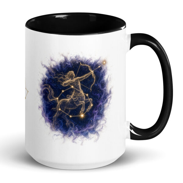 White ceramic mug with black interior and handle, showing the enlarged gold and navy Sagittarius constellation orb