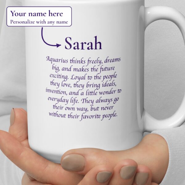 Close-up of the personalized Aquarius Day & Night mug showing the example name Sarah above three Aquarius sayings, with a label: Your name here, personalize with any name
