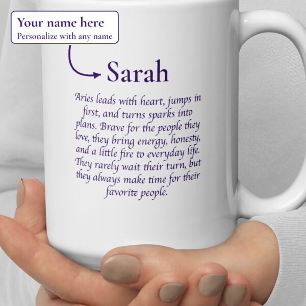 Close-up of the personalized Aries Day & Night mug showing the example name Sarah above three Aries sayings, with a label: Your name here, personalize with any name