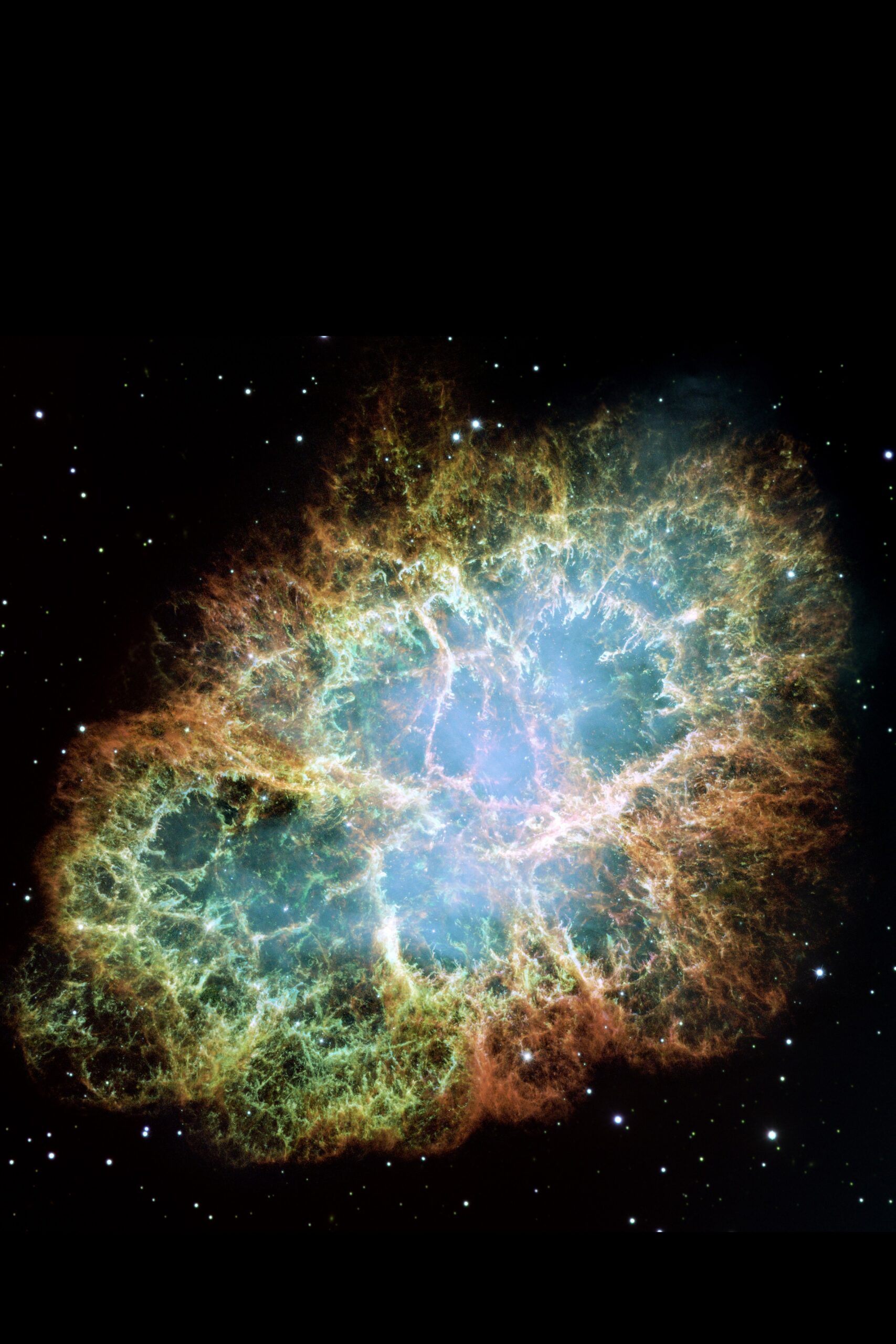 The Crab Nebula, orange and red threads of gas around a blue-white heart