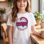 Scorpio Graffiti Street Sign kids T-shirt in white, worn by a girl in a bright café